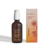 A bottle and box of FORIA Vibrance Everyday Body Oil with Organic Botanicals.