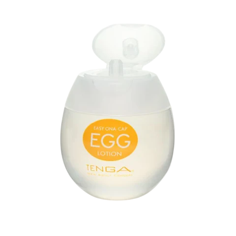 A small, egg-shaped bottle of Tenga Egg Lotion lubricant with an open cap.