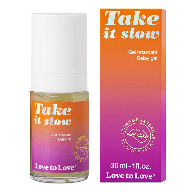 A bottle and box of Love to Love Take it slow delay gel with a gradient orange to purple design.