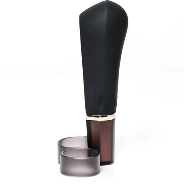 Black wearable finger vibrator with a rose gold band and a translucent ring.