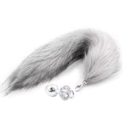 Grey faux fur tail with a silver anal plug.