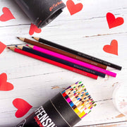 A set of 48 offensive colored pencils with humorous names on a wooden surface.