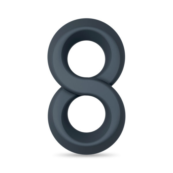 A dark gray silicone cock ring in a figure-eight shape.