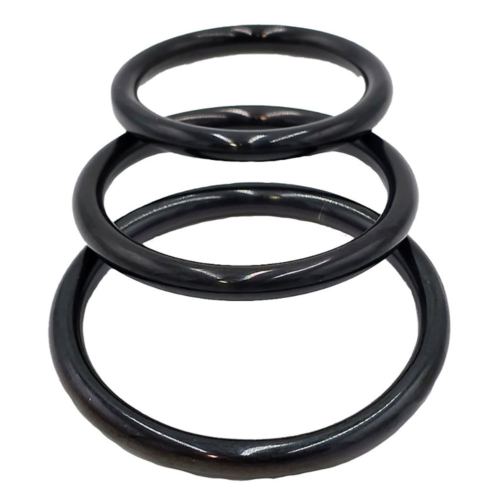 Three black stainless steel rings of varying sizes.