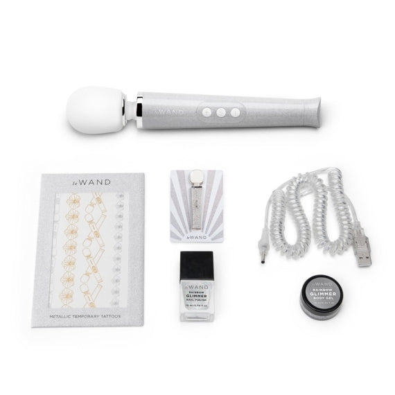 Le Wand Petite Rechargeable Wand Massager Set with nail polish and body gel.