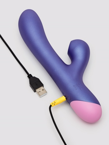 Purple rabbit vibrator with USB charging cable and yellow audio jack.