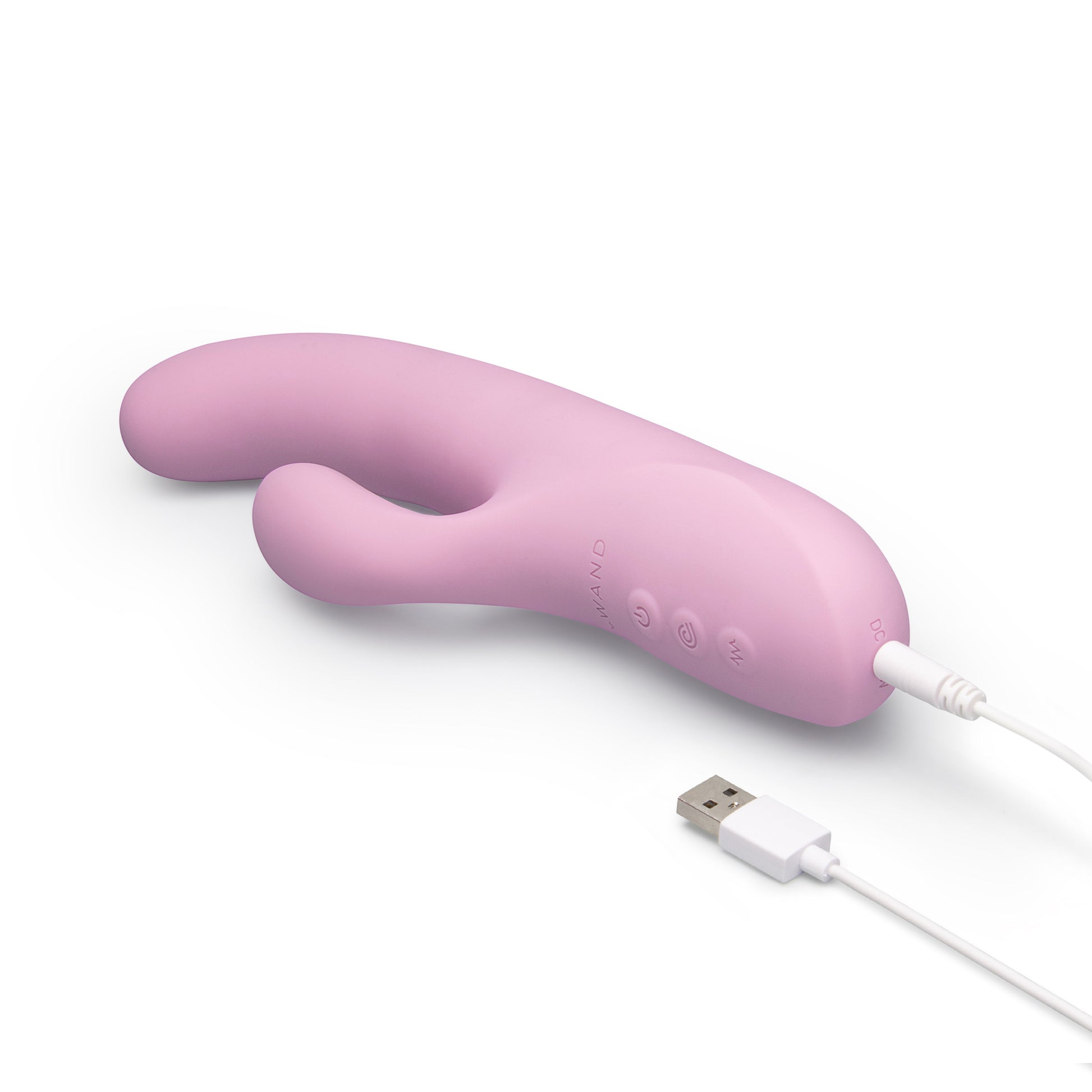 A pink silicone vibrator with a curved design and USB charging cable.