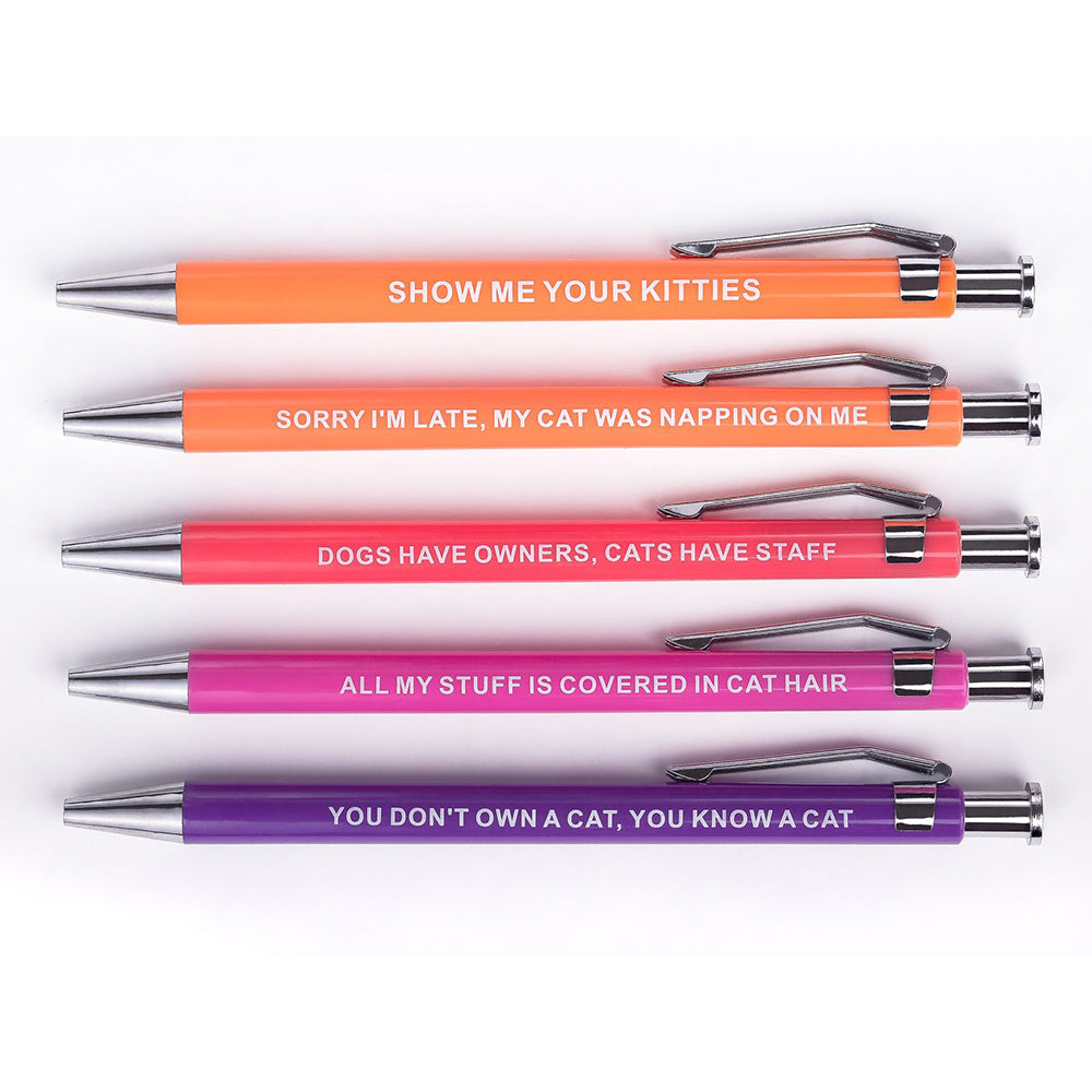 Five colorful pens with funny cat-themed phrases.