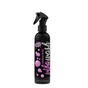 A black spray bottle of Wet Antibacterial Vibe Wash with purple bubbles and text.
