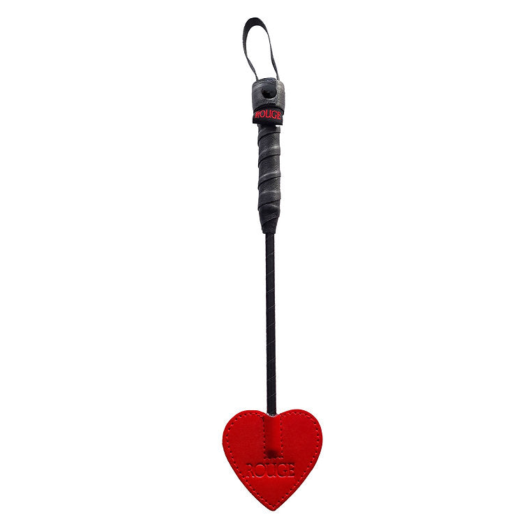 Black leather crop with a red heart-shaped paddle and "ROUGE" branding.