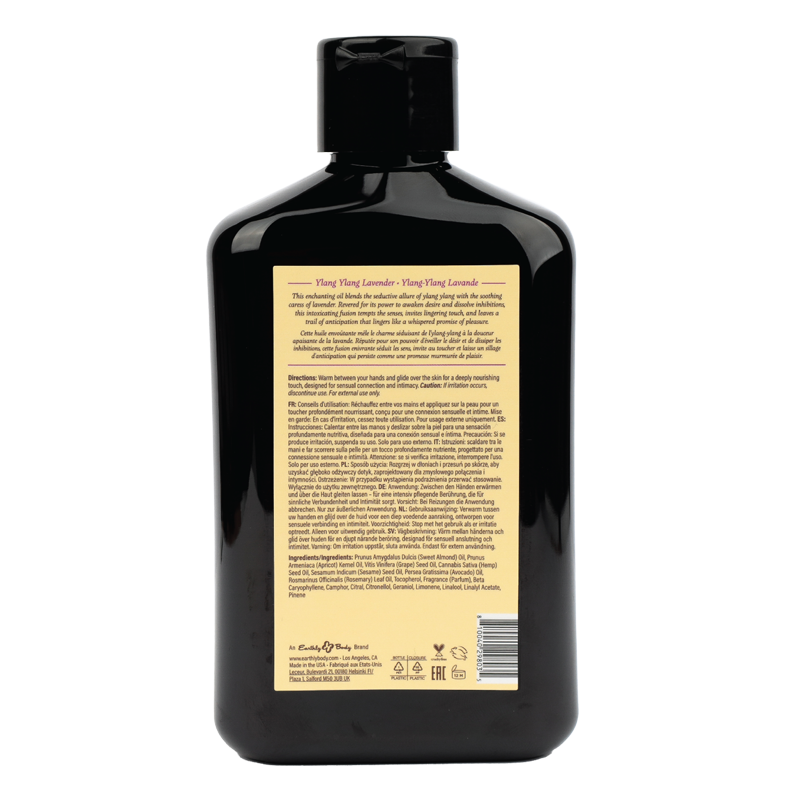 A black bottle of massage oil with Ylang Ylang and Lavender.