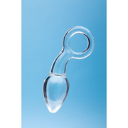 Clear glass anal plug with a tapered tip and a loop handle.