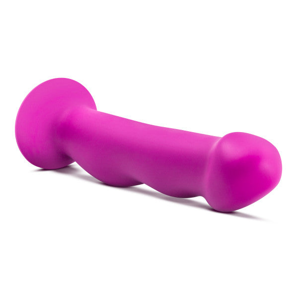A violet dual density silicone G-spot toy with a flared base and curved shaft.