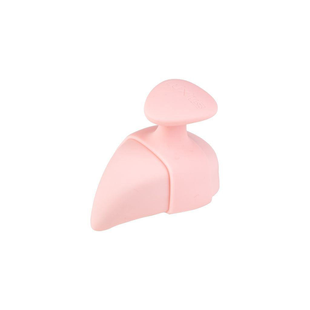 A pink silicone shoe tree with a triangular top.