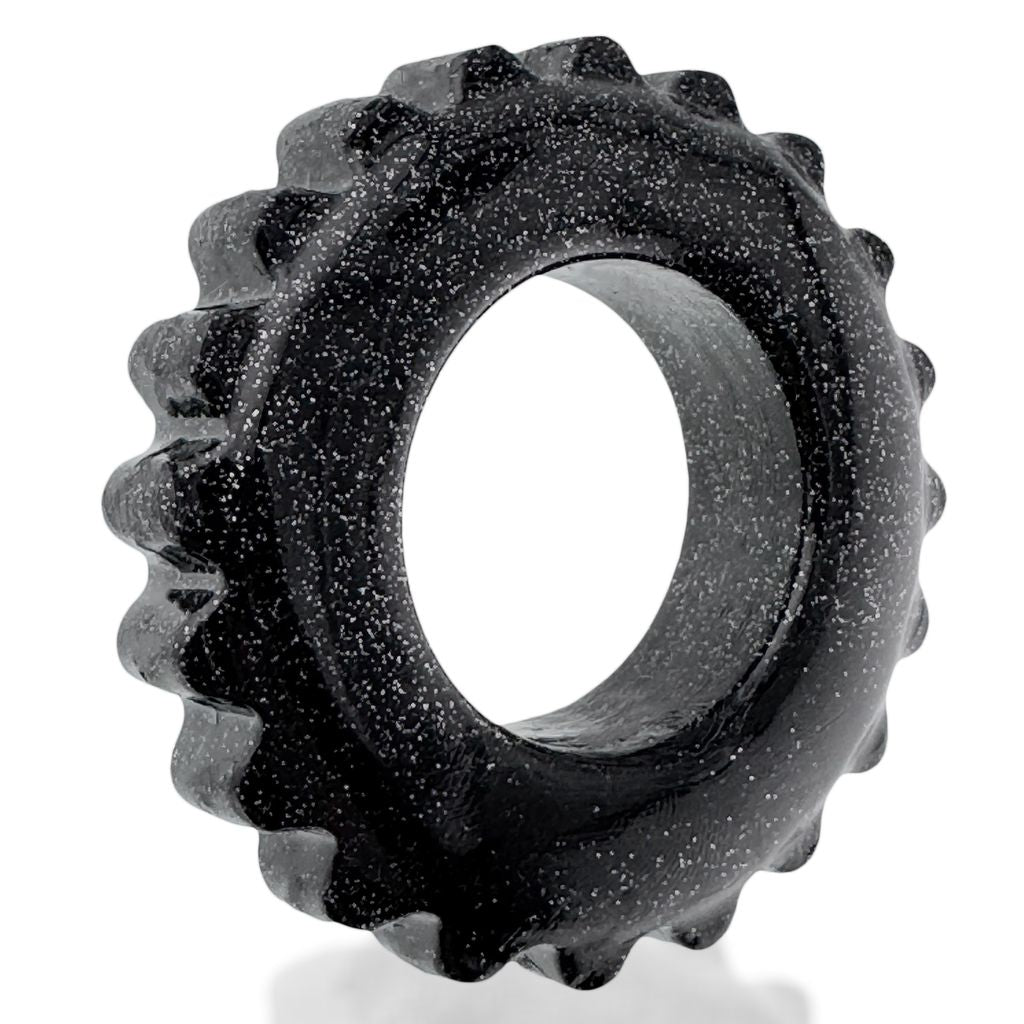 Black speckled TPR cock ring with textured outer edge.