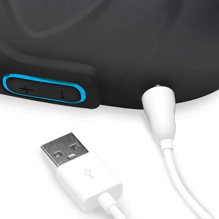 Black vibrating silicone ball sack with USB charging cable.