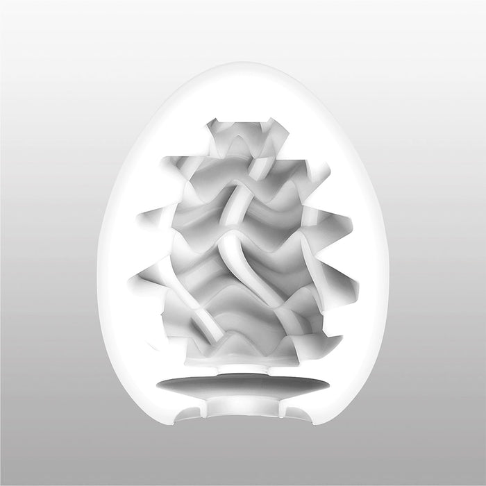 White egg-shaped male masturbator with wavy internal texture.