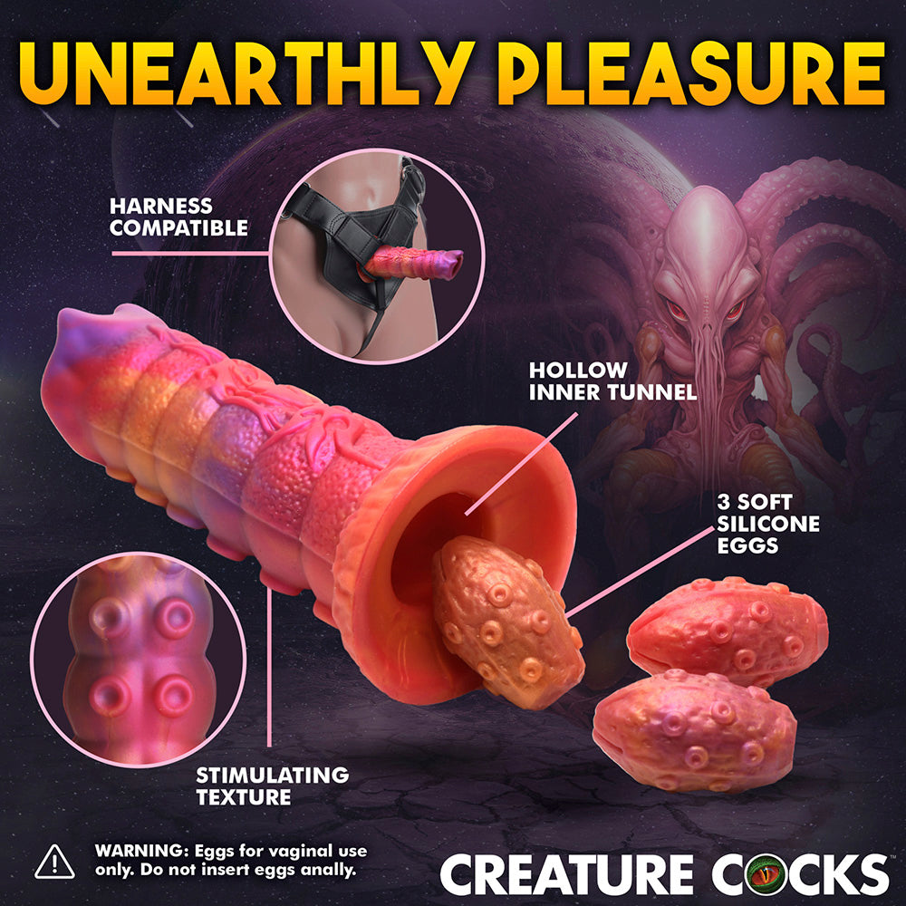 Fantasy dildo with textured surface, hollow tunnel, and three silicone eggs.