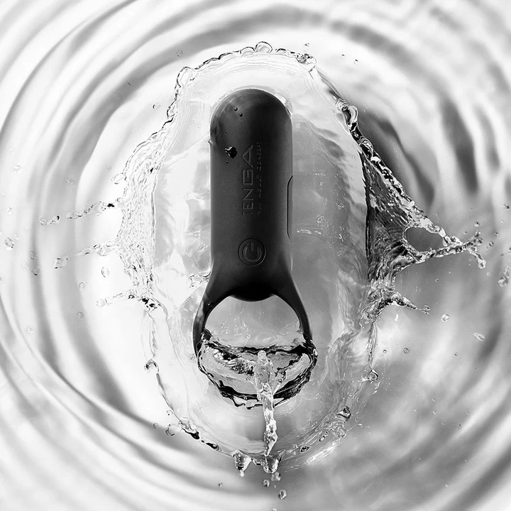 Black Tenga SVR+ vibrating cock ring submerged in water.