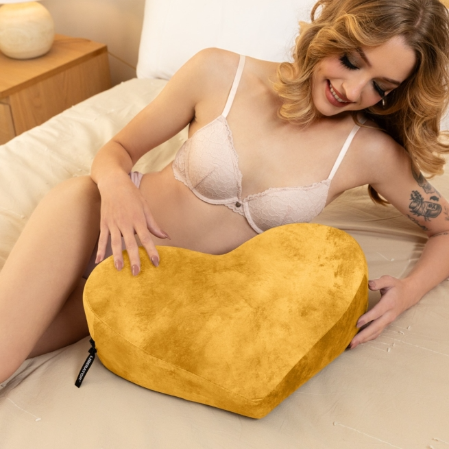 Heart-shaped positioning pillow in Ibiza Gold velvet.