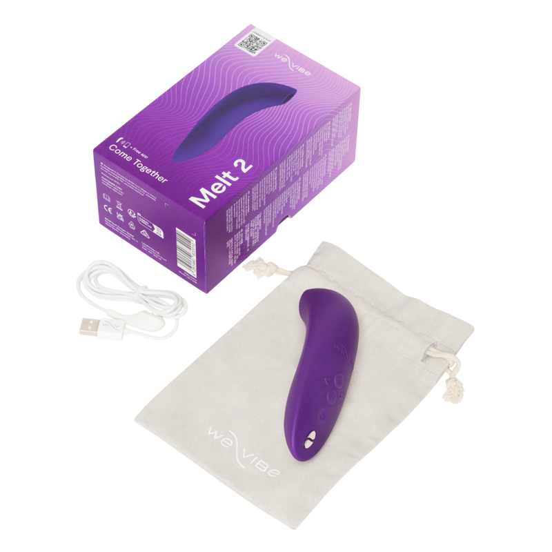 Purple We-Vibe Melt 2 clitoral stimulator with charging cable and storage bag.