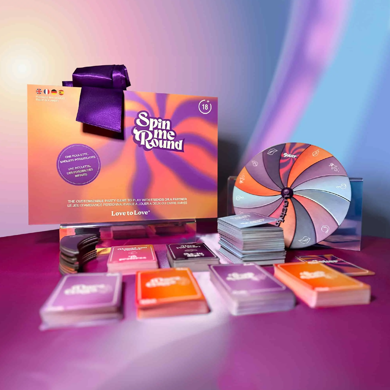 Spin Me Round adult roulette game with cards and a spinning wheel.