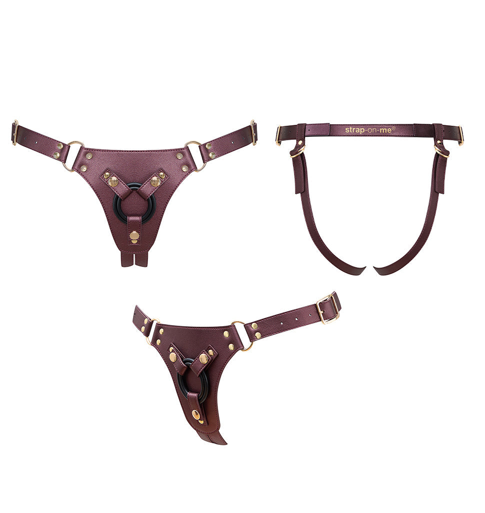 Adjustable aubergine pegging harness with metal hardware.