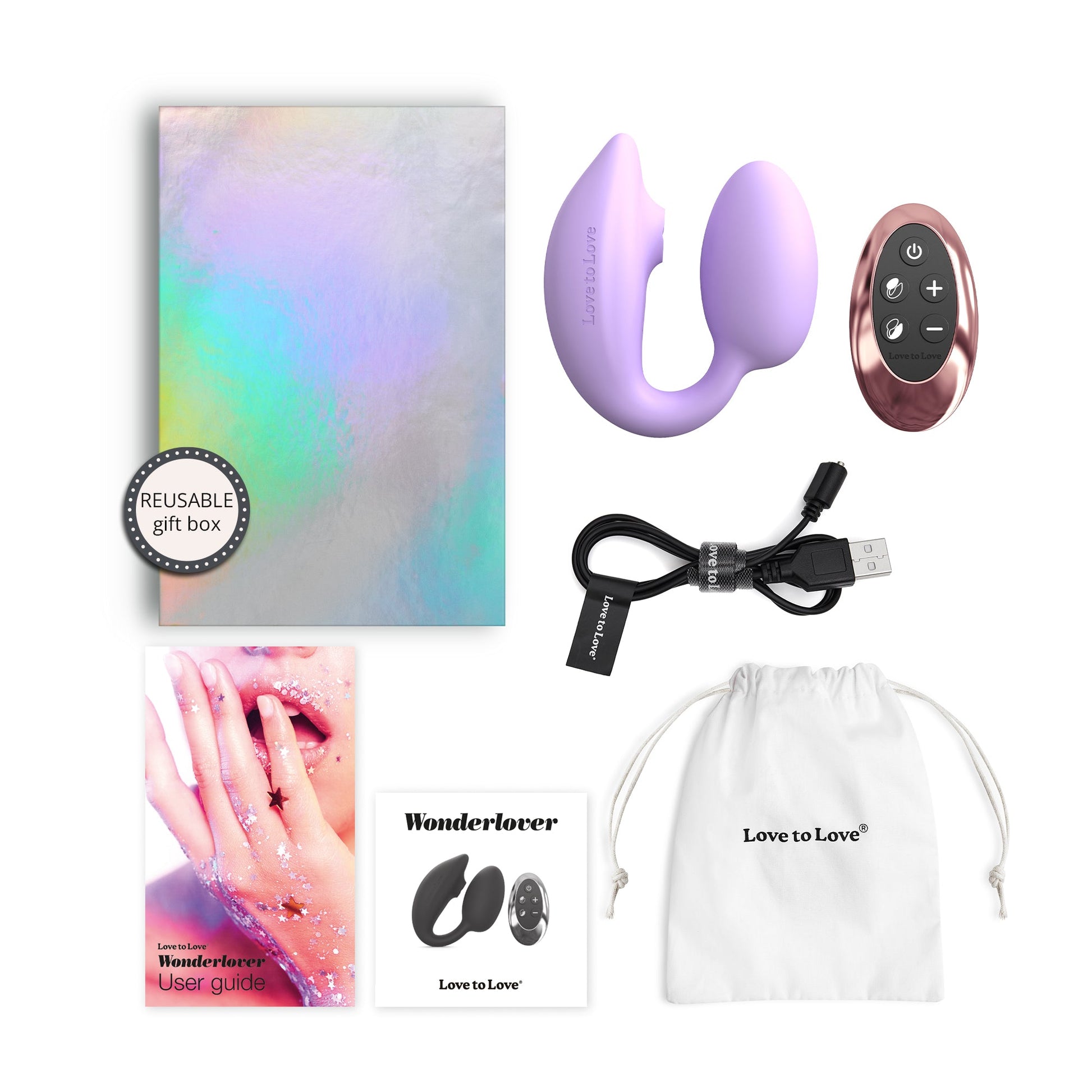 A mauve dual stimulation vibrator with a remote, charging cable, gift box, and user guide.