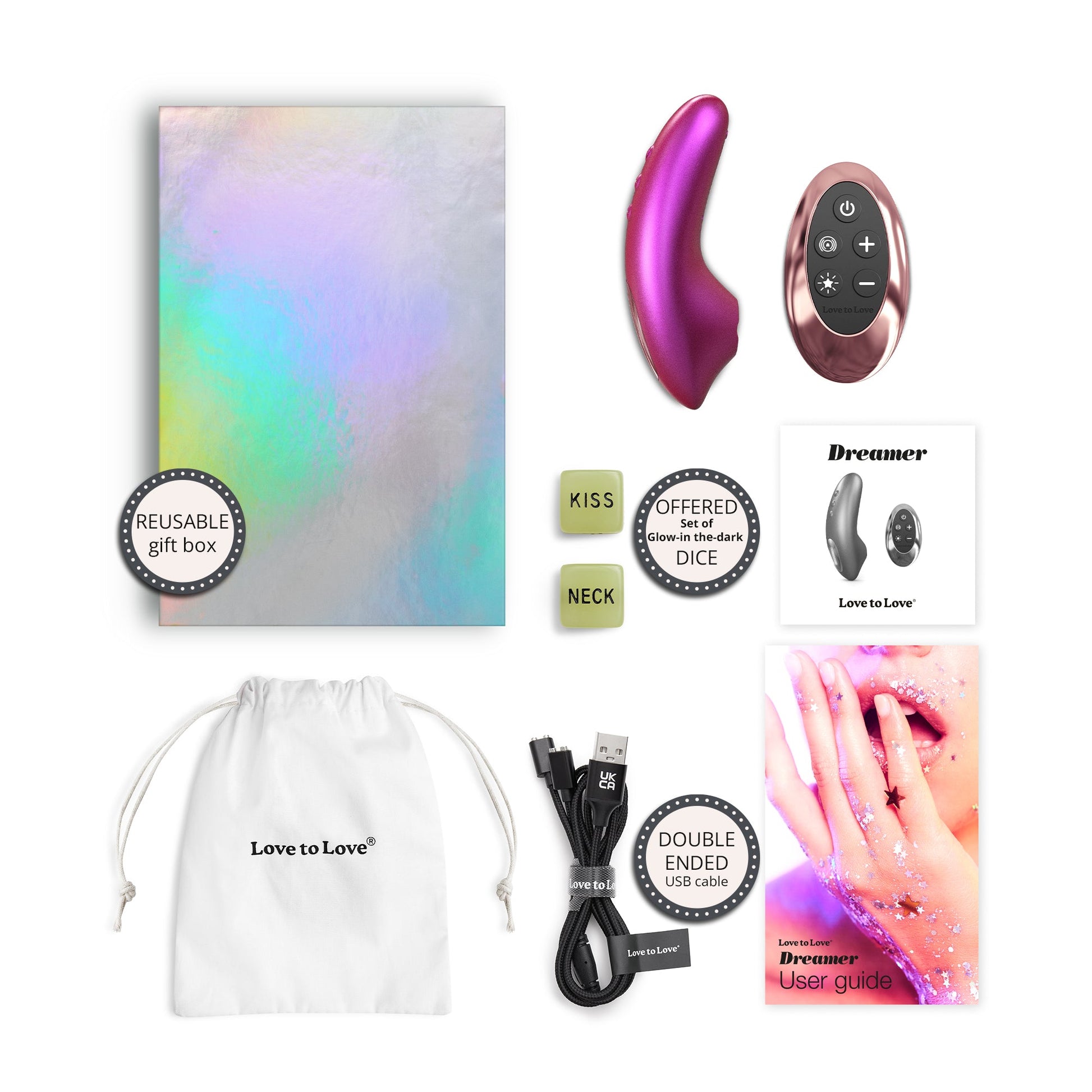 Dreamer clitoral stimulator with remote, gift box, dice, USB cable, and user guide.