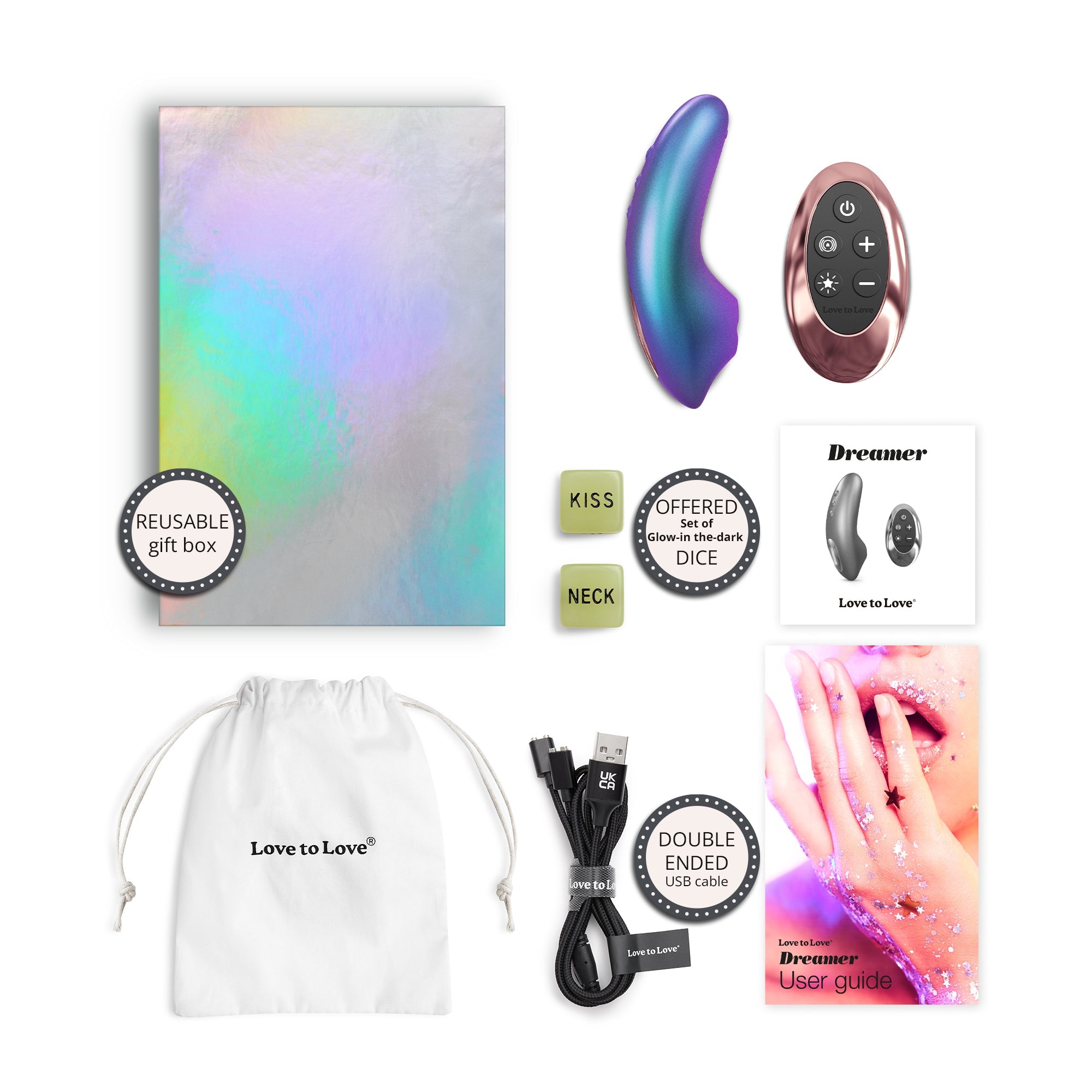 Dreamer clitoral stimulator with remote, gift box, dice, USB cable, and user guide.