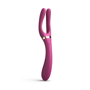 A pink vibrator with two curved arms and gold accents.