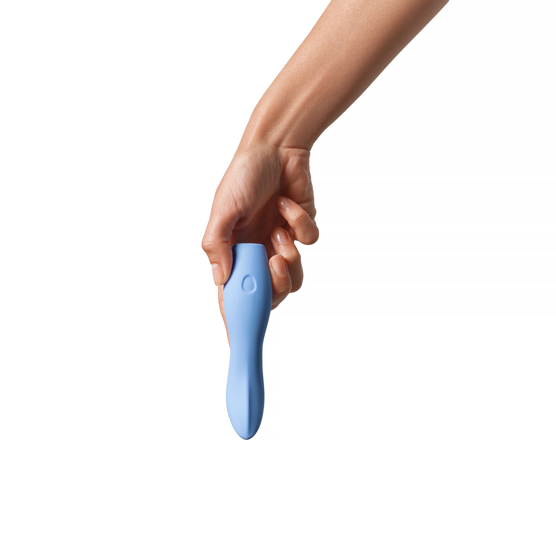 A hand holds a periwinkle silicone vibrator with a single button.