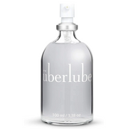 Überlube silicone personal lubricant in a clear glass bottle with a white pump dispenser.