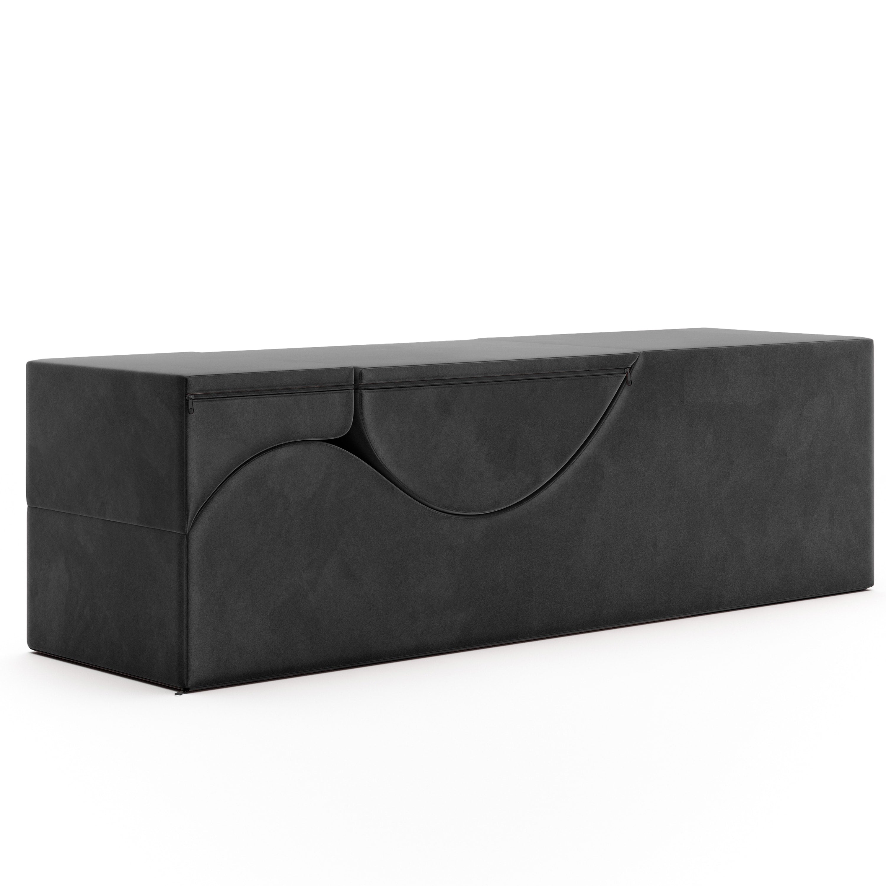 Black velvet convertible bench with curved design.