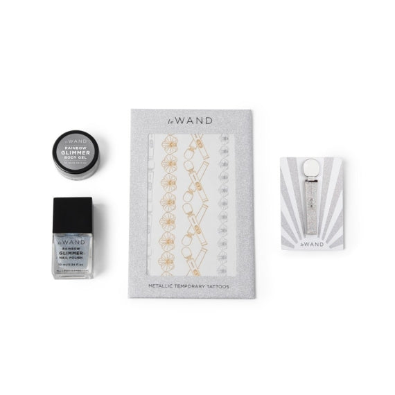 Le Wand Petite Rechargeable Wand Massager Set with body gel, nail polish, and temporary tattoos.