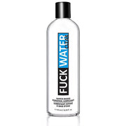 A clear bottle of FuckWater Clear water-based lubricant with a black cap.