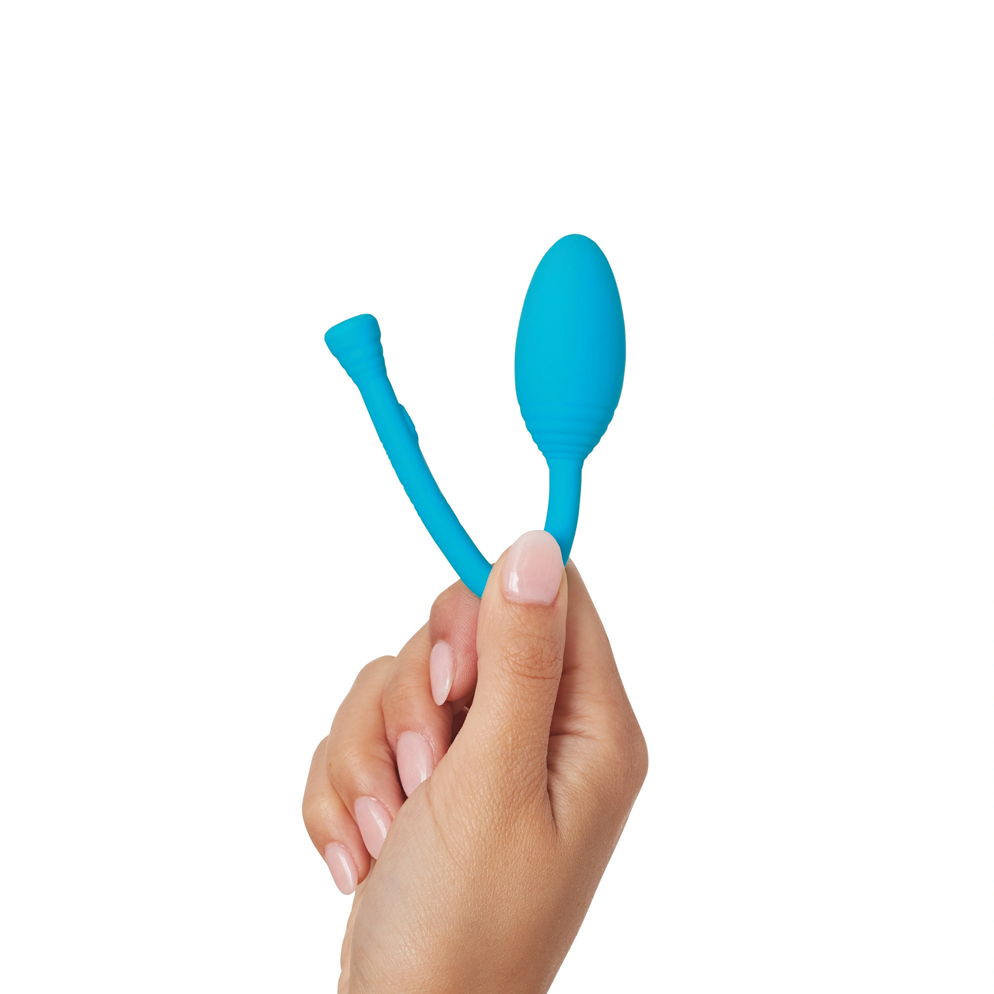 A hand holds a blue silicone kegel trainer with a remote.