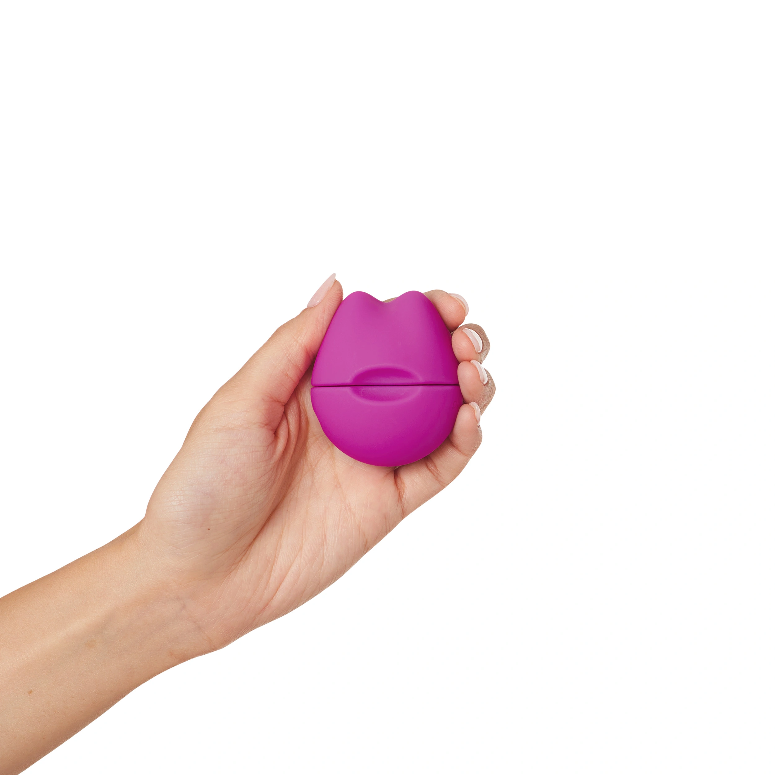 A hand holds a small, purple, lip-shaped vibrator.