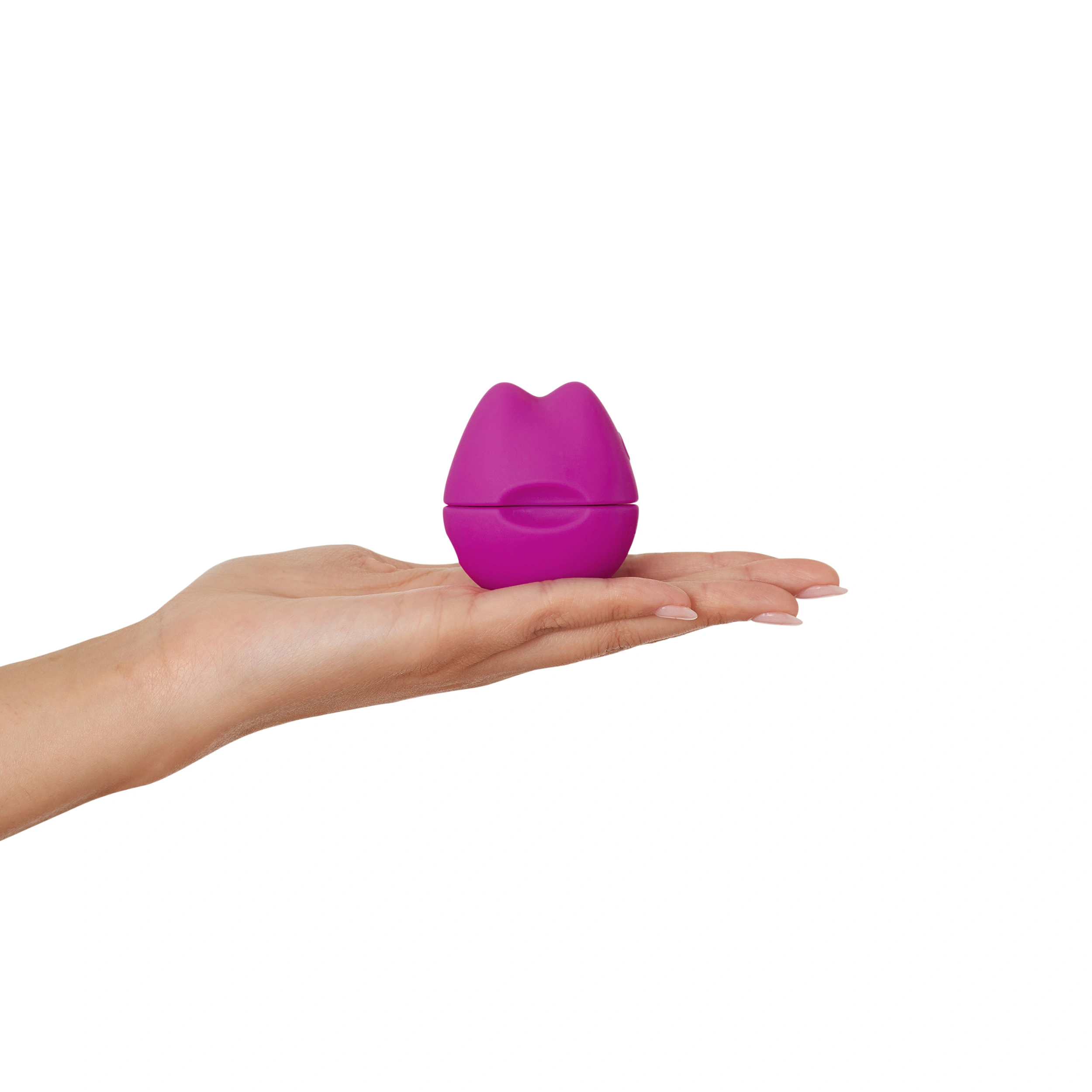A purple lip-shaped vibrator rests on an open palm.