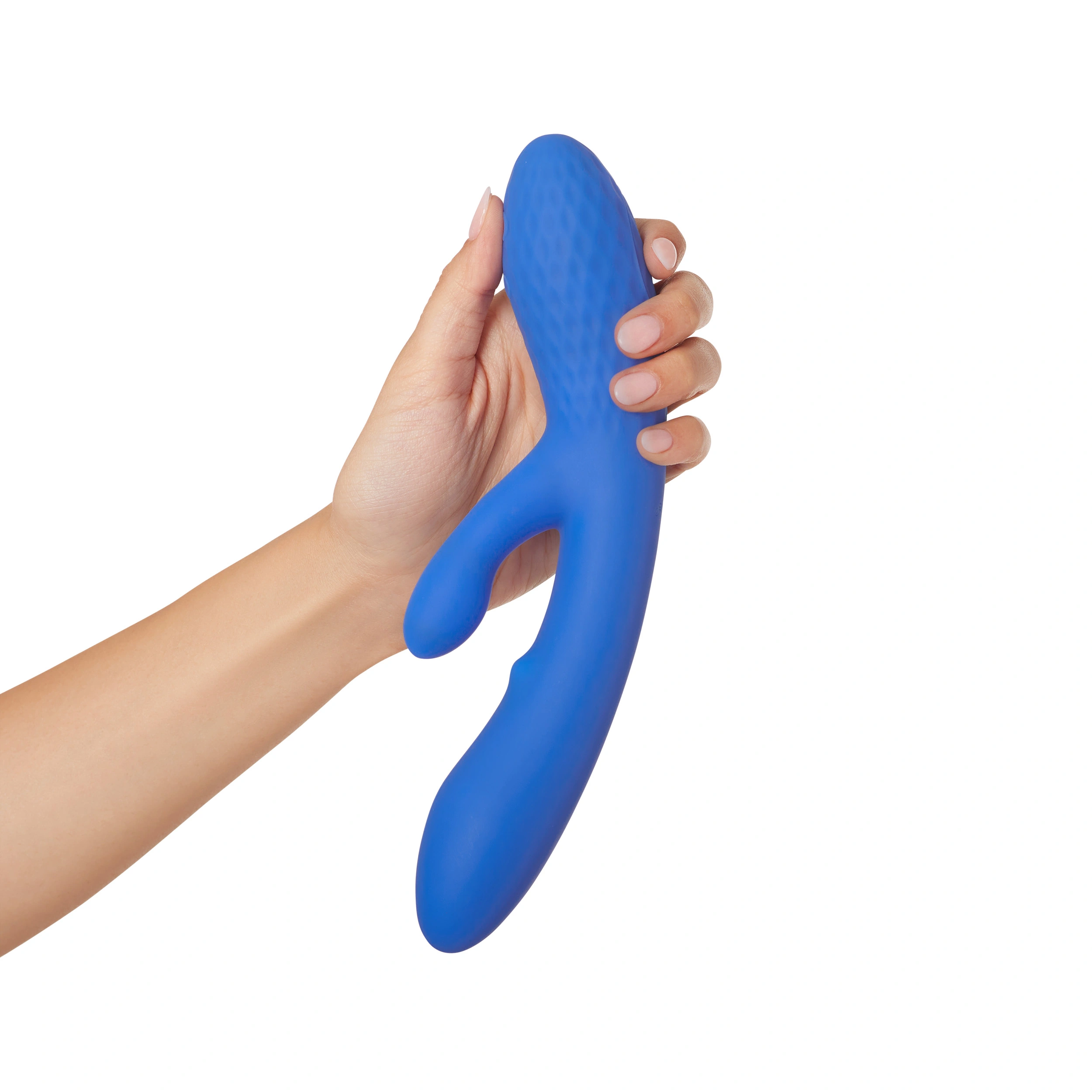 A hand holds a blue dual G-spot massager with a textured head.