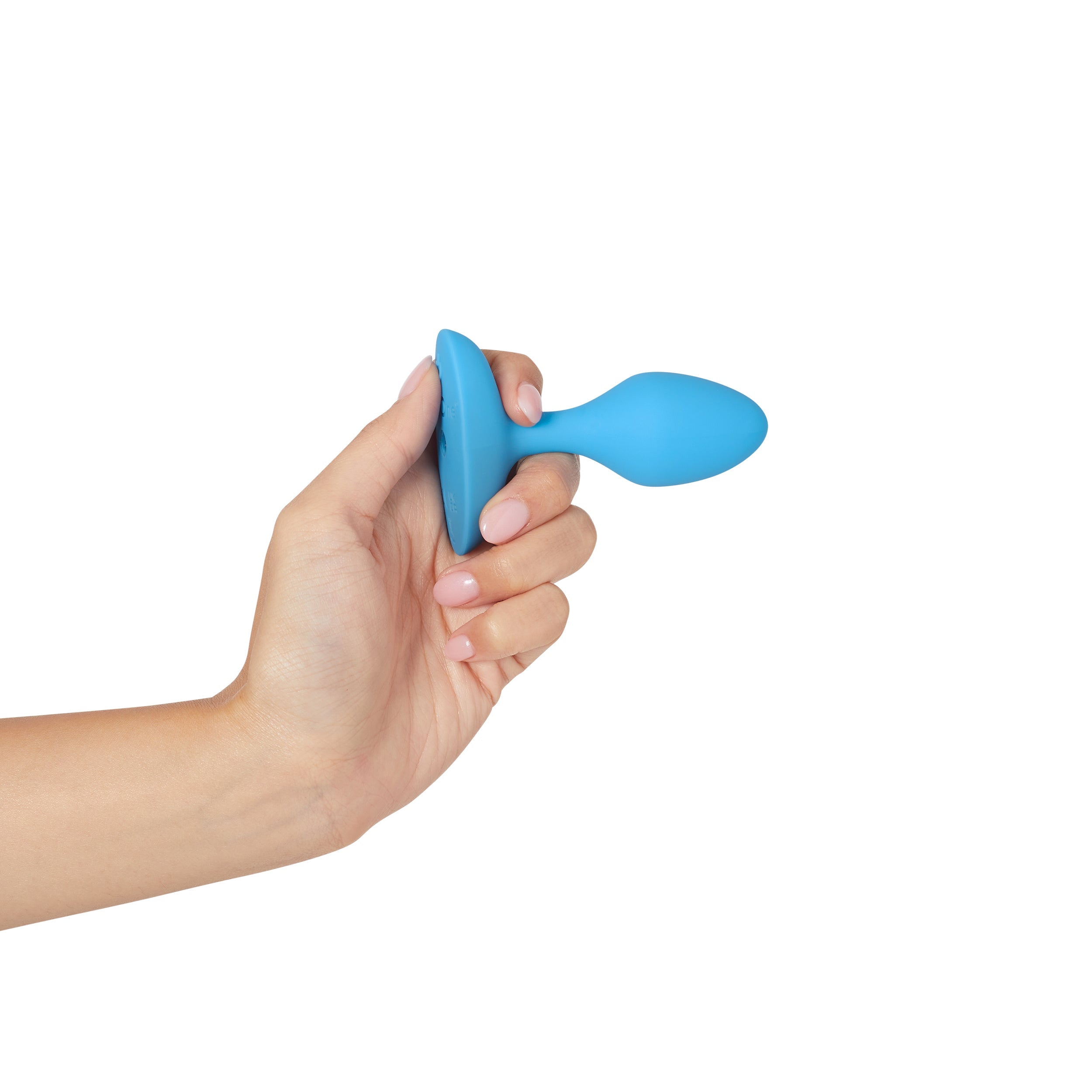 Blue vibrating anal plug held in a hand.