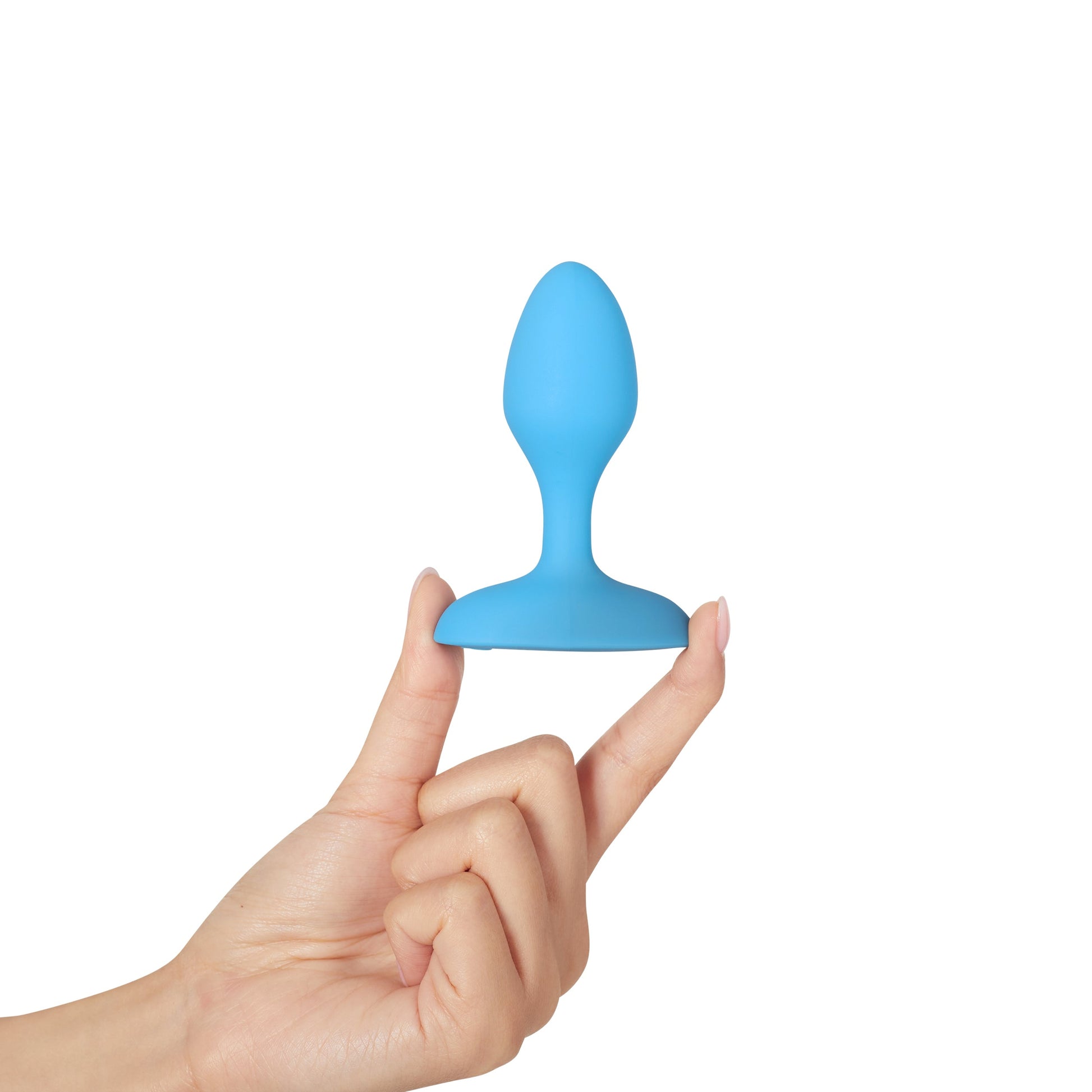 A blue vibrating anal plug held between two fingers.
