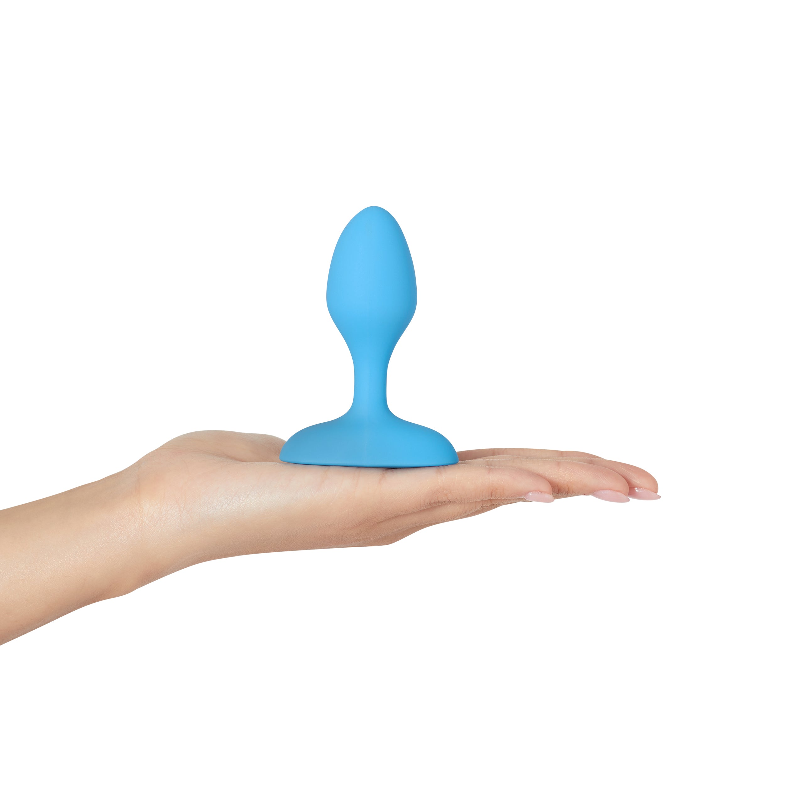 A blue vibrating anal plug with a flared base rests on an open palm.