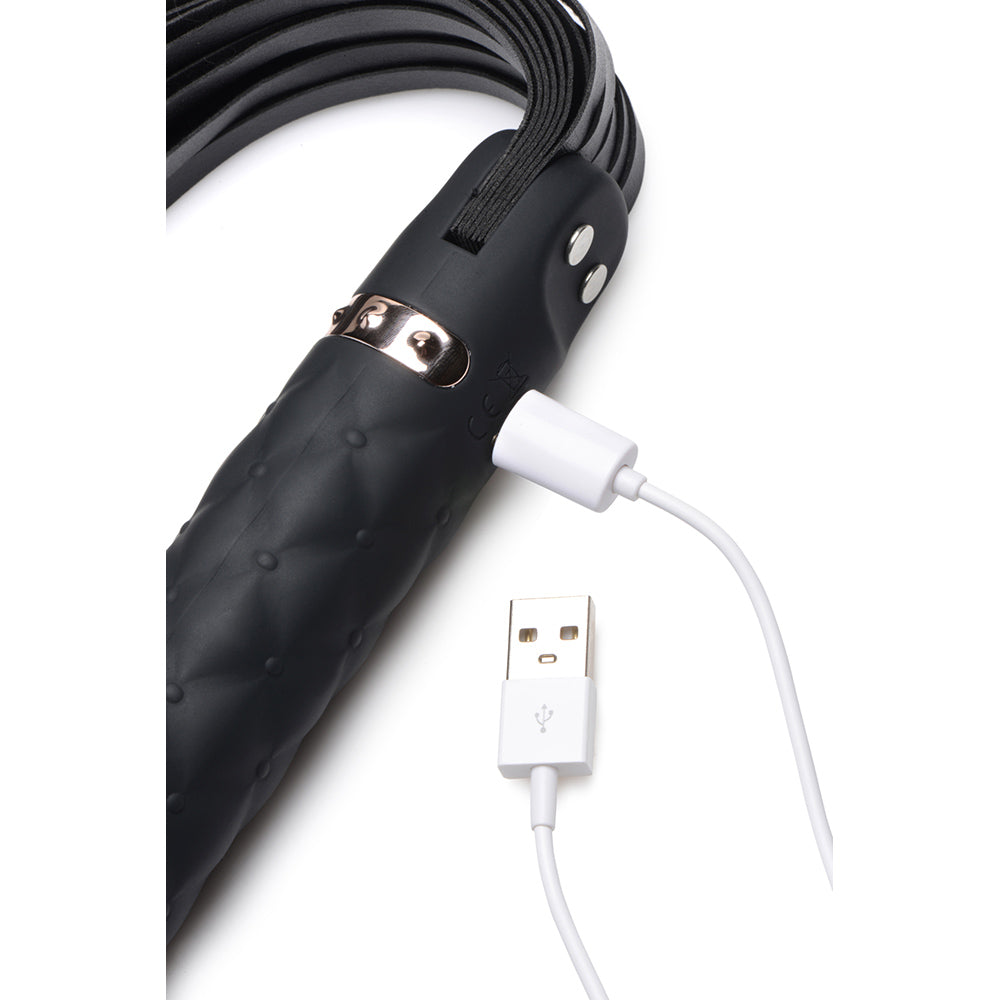 Black vibrating dildo flogger with USB charging cable.