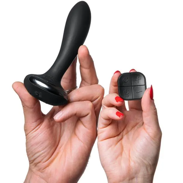 Black remote-controlled prostate vibrator with a flexible base.