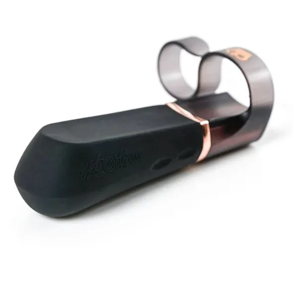 DiGiT wearable finger vibrator in black with rose gold accents and curved loops.