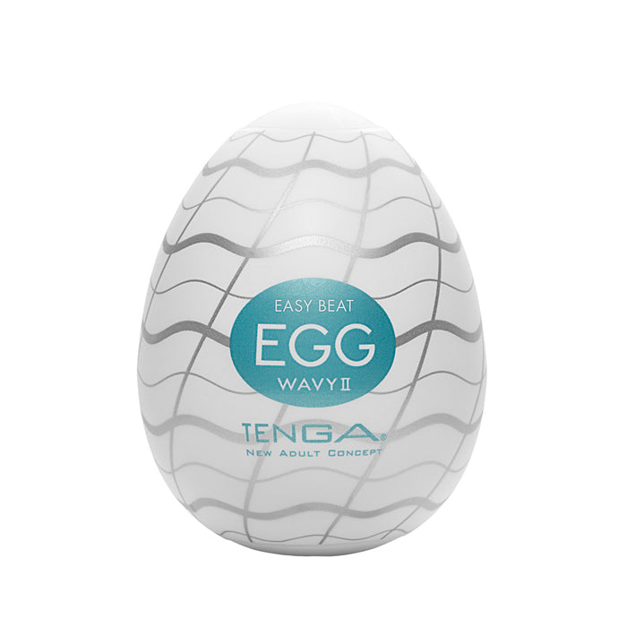 A white egg-shaped Tenga masturbator with wavy silver lines and a teal label.
