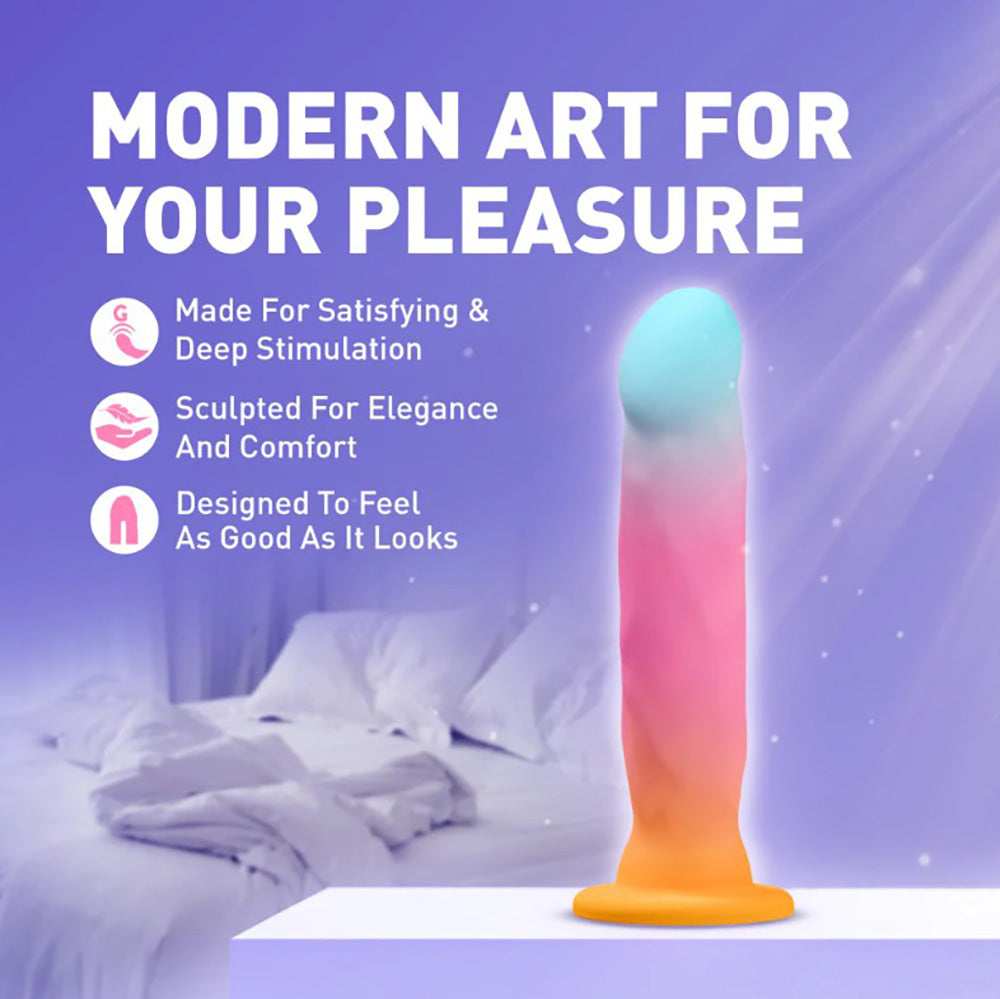 A gradient pink and blue silicone stimulator with text about pleasure and comfort.
