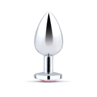 Silver metal anal plug with a pink jewel at the base.