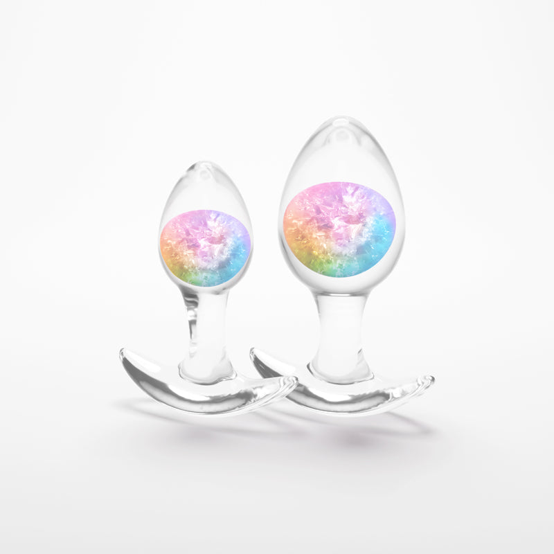 Two clear glass butt plugs with rainbow inserts.